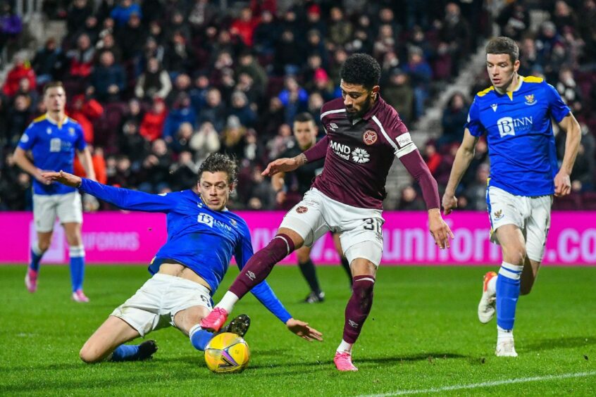 Murray Davidson tackles Josh Ginnelly during his side's recent defeat to Hearts.