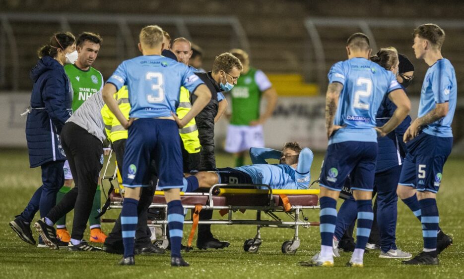 Darren Whyte is stretchered off the field in the League Cup clash with Hibs in October 2020.