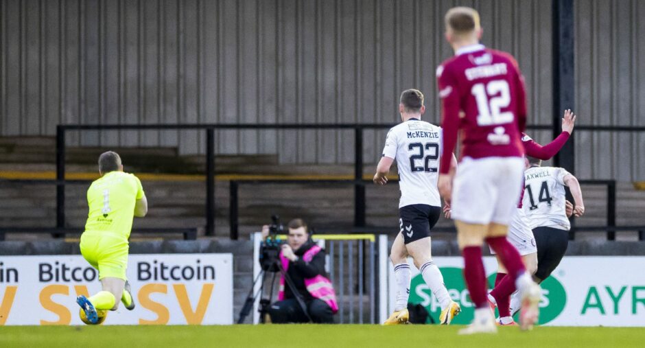 Ayr's James Maxwell (14) rounds Derek Gaston to score a rare winner against Arbroath earlier in January.