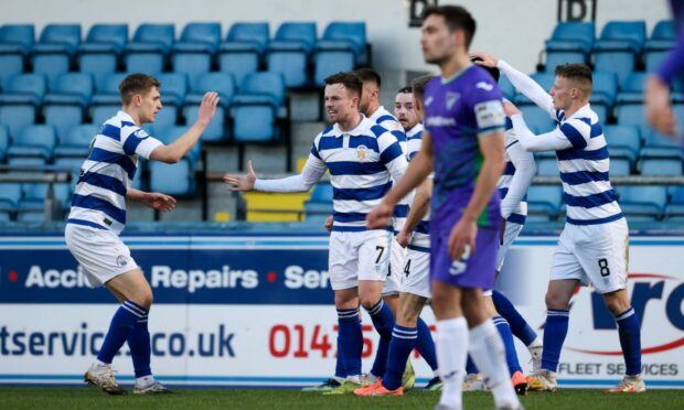 Gary Oliver celebrates in the 5-0 triumph