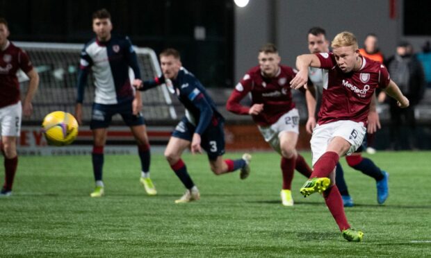 Nicky Low slots home from the penalty spot completing Arbroath's comeback in the 2-1 win over Raith Rovers.