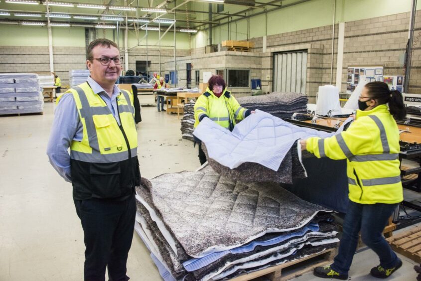 Staff members at Dovetail: a factory producing mattresses in Dundee