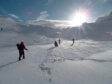 Caledonian Hillwalking Club members hiking through snow.