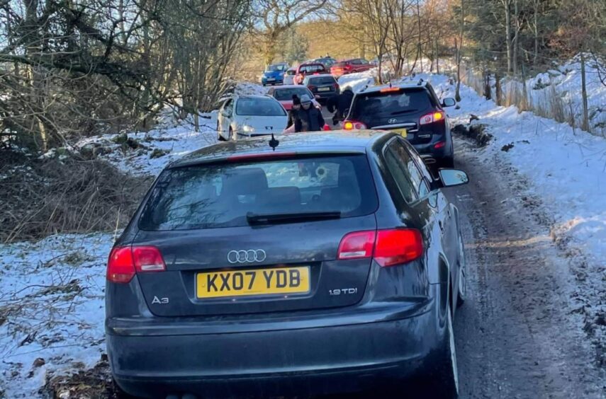 A pile up of cars on a narrow, snowy road on Falkland Hill in January, 2021