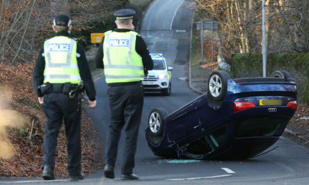 The car on its roof on Emmock Road.