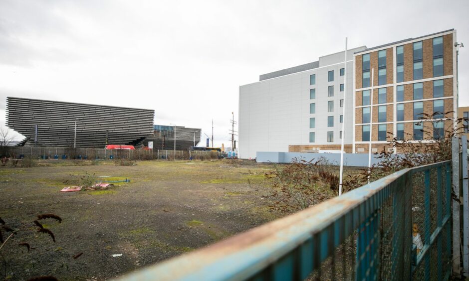 The empty site next to Agnes Husband House.