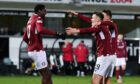 Joel Nouble celebrates with teammates in one of his last games for Arbroath.