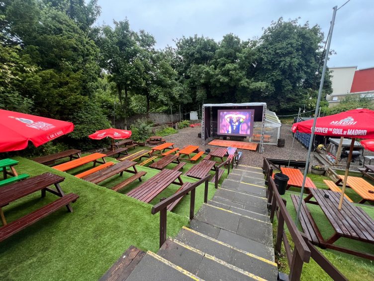 Giant screen for watching sports in O'Marleys beer garden