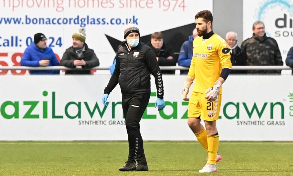 Aaron Lennox leaves the field with the Montrose physio.