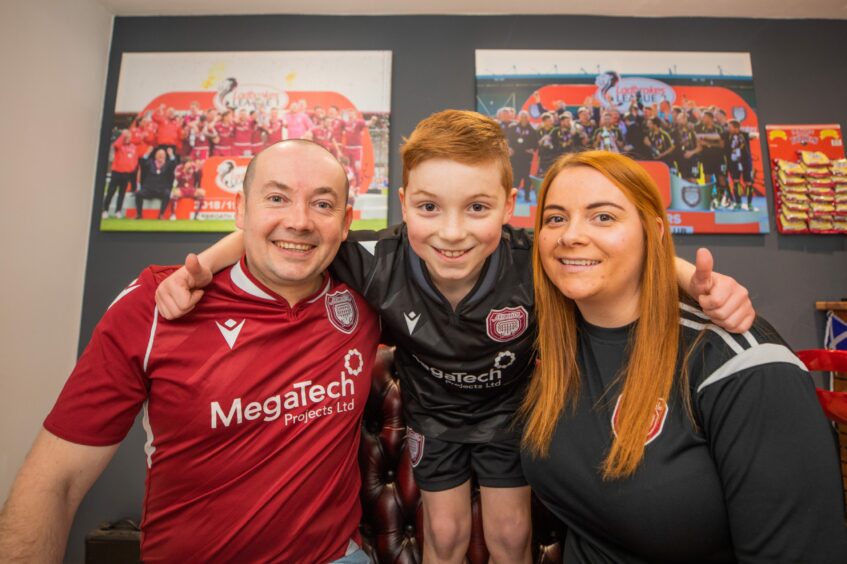 Kenny with his partner Jacqui and Jacqui's son Theo (aged 9).