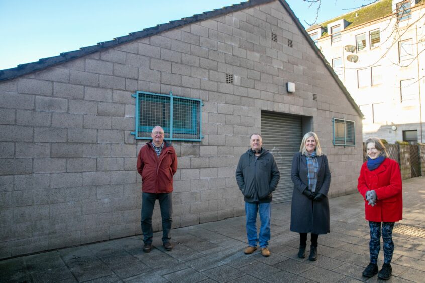 Cllr Andrew Parrott, Jeffrey Wiseman (volunteer), Susan Scott (manager) and Ajay Close (patron) outside the former toilets that they are looking to convert for Plus Perth.