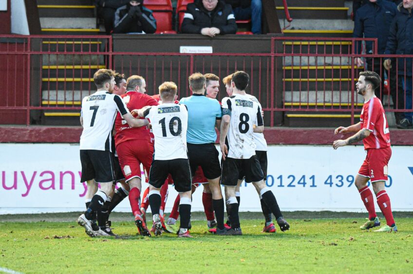 A scuffle breaks out between the players after Max Kucheriavyi's challenge on Ryan Cowie.