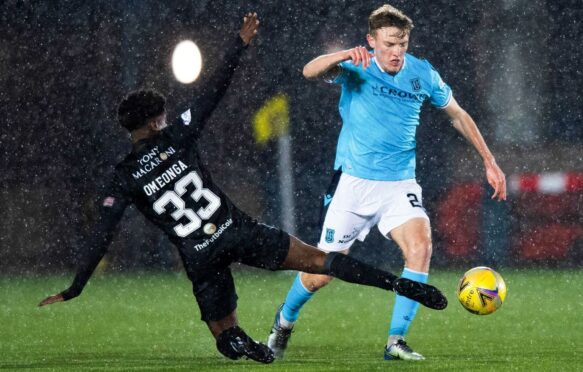 Dundee's Max Anderson takes on Stephane Omeonga of Livingston.