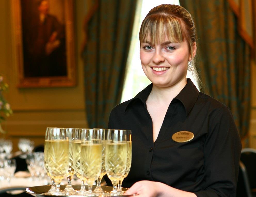 Waiter serving drinks at University of St Andrews.