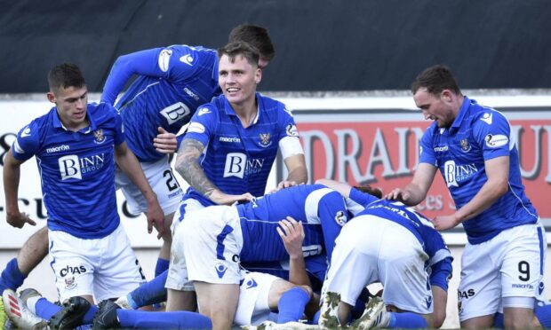 The St Johnstone players celebrate a Callum Hendry winner that took them off the bottom of the table.