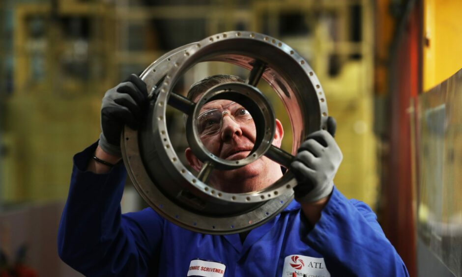 Ronnie Scrivener, an aero Inspector looking at the quality of a gem casing.