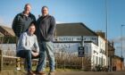 Tutties Arbroath Supporters' Club members Jon Bruce, Kevin Small and chairman Allen Innes outside the famous pub. Pic: Mhairi Edwards/DCT Media.