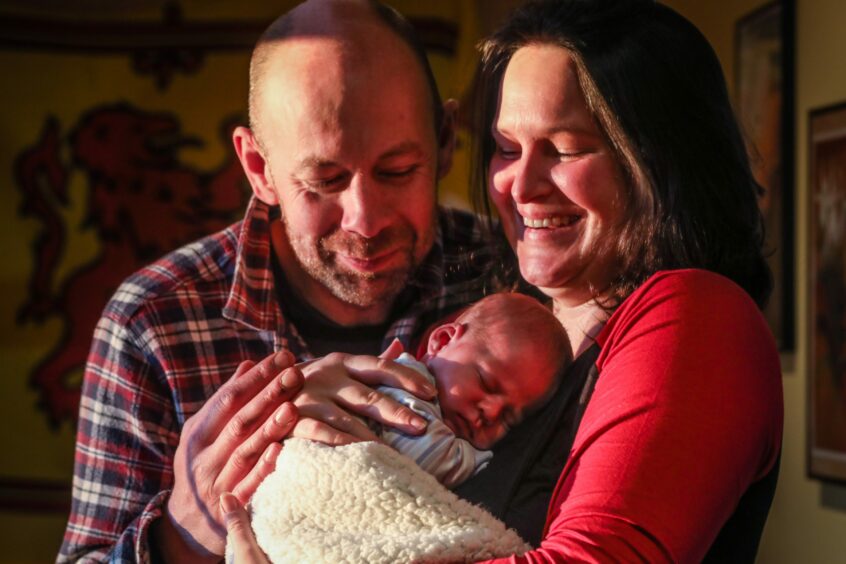 The couple with their newborn son.