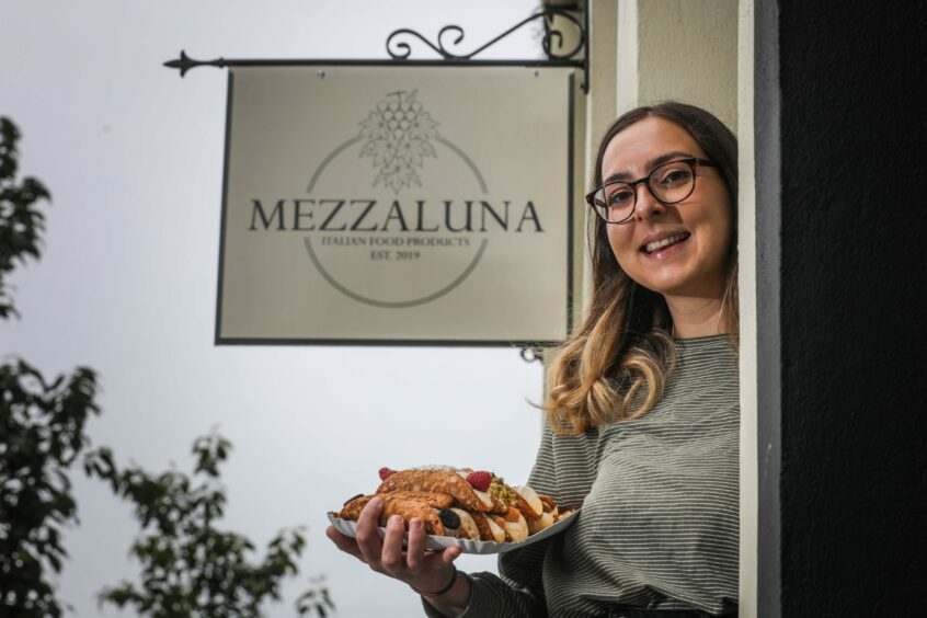 Mezzaluna owner, Chiara Di Ponio-Horne with some of their famous cannoli.