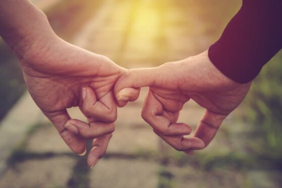 Couple holding hands. Valentine's Day ideas 2022