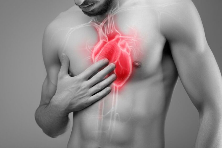 A man touching his chest where his heart is and a heart graphic overlaid on his body