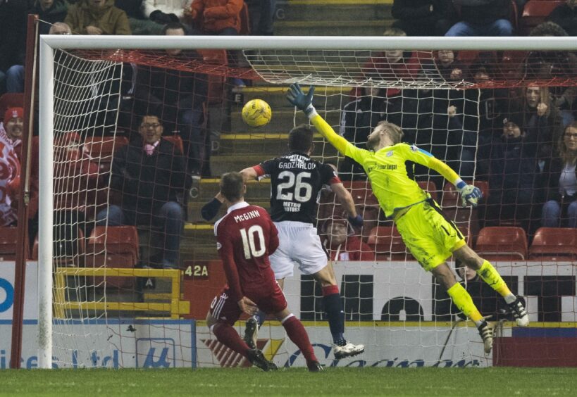 Niall McGinn scores against Dundee in 2017.