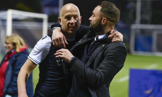 Charlie Adam and McPake celebrate after Dundee's play-off win last season.