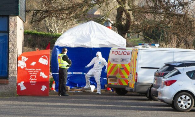 A blue tent and forensics officers at the scene in Arbroath.