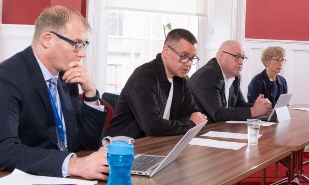 The sombre faces of those in charge at Angus Council (L-R) Ian Lorimer, director of finance; Councillor Mark Salmond, finance convener; Councillor David Fairweather, council leader; Margo Williamson, chief executive.