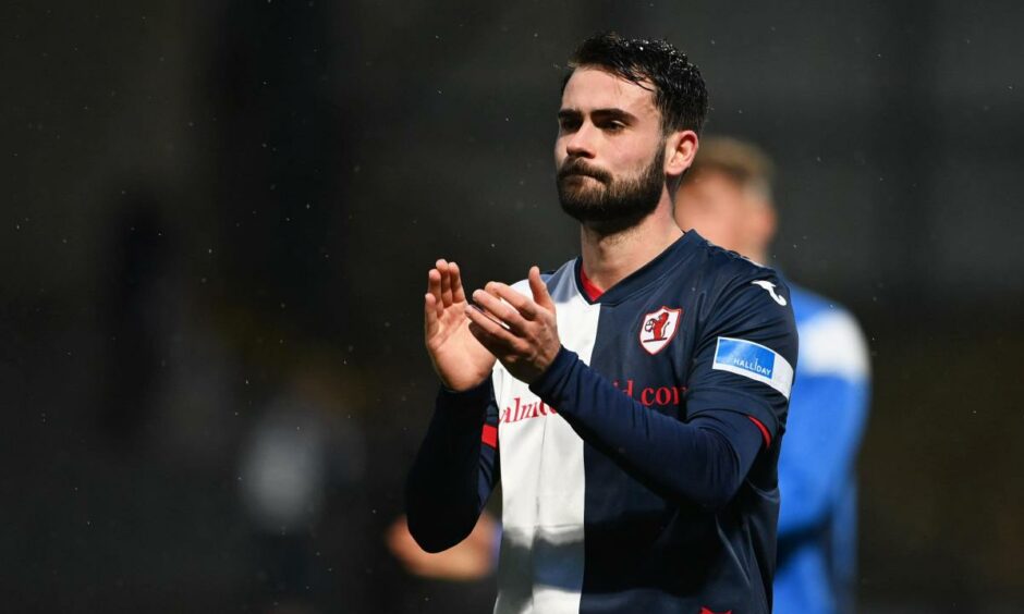 Reghan Tumilty applauds the Raith Rovers fans.