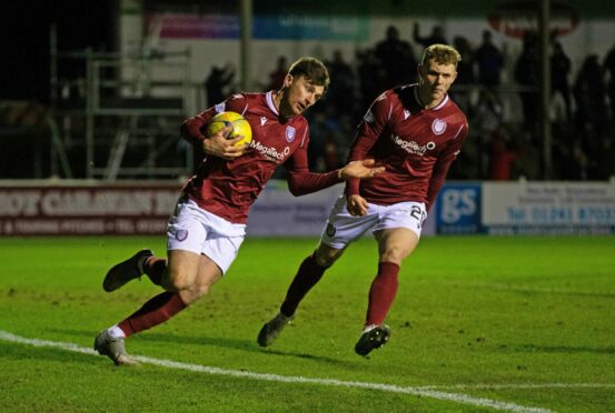 Michael McKenna collects the ball after making it 2-2.