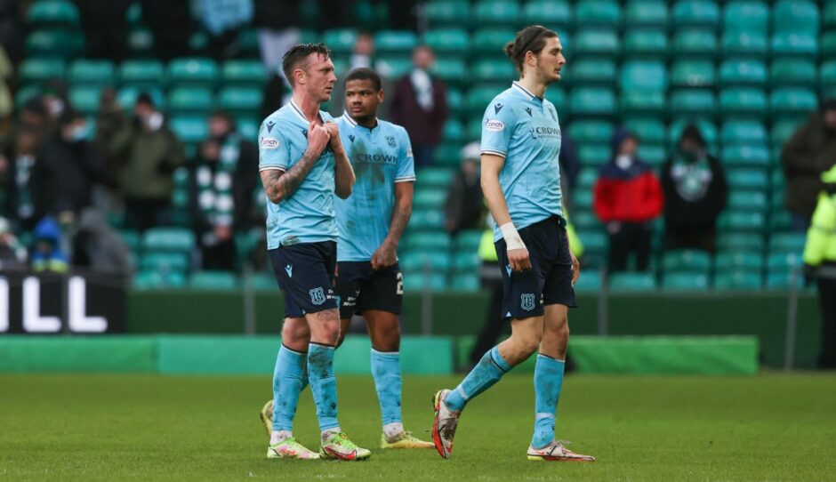 Dundee's Jordan McGhee, Vontae Daley-Campbell and Zeno Ibsen Rossi at full time after defeat at Celtic.