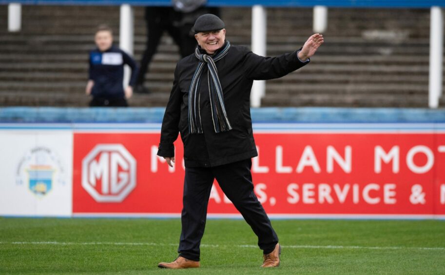 Dick Campbhell acknowledges the travelling support before the game.