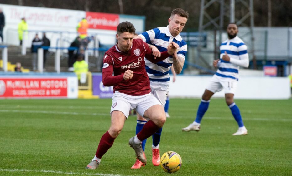 Michael McKenna shrugs off pressure from Morton's Gary Oliver 