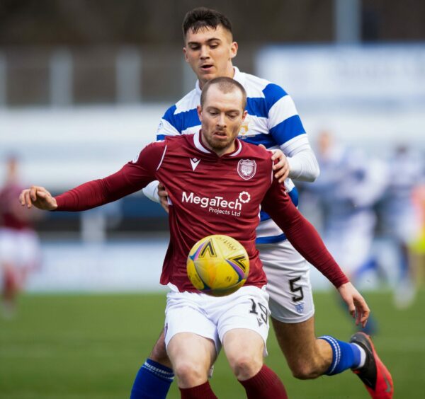 Arbroath's Craig Wighton under pressure from Oisin McEntee.