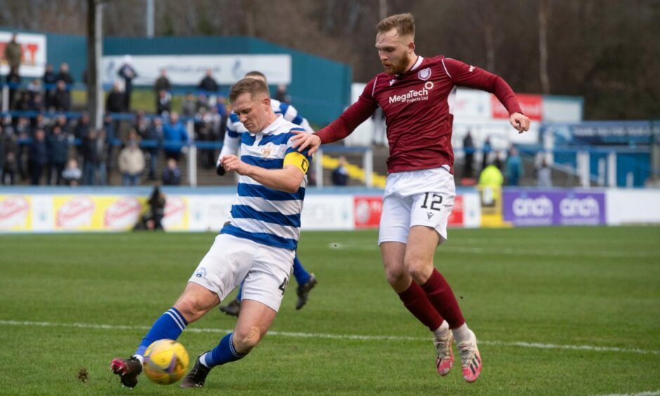 Arbroath's Scott Stewart challenges Alan Lithgow of Morton.