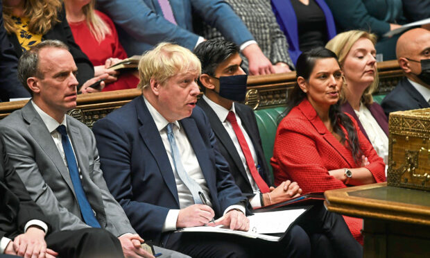 From left, Justice Minister and Deputy Prime Minister Dominic Raab, Prime Minister Boris Johnson, Chancellor of the Exchequer Rishi Sunak, Home Secretary Priti Patel and Foreign secretary Liz Truss listening to a response after the Prime Minister delivered a statement to MPs in the House of Commons on the Sue Gray report. Photo by UK Parliament/Jessica Taylor/PA Wire