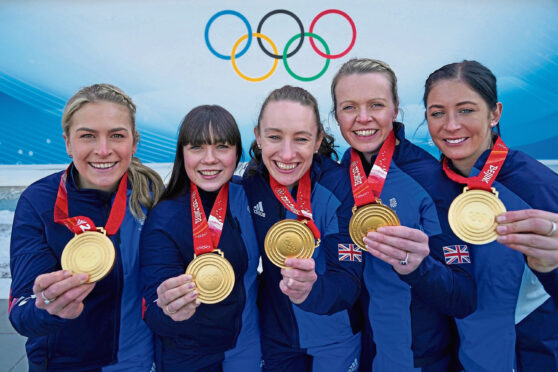 Great Britain's Mili Smith, Hailey Duff, Jennifer Dodds, Vicky Wright and Eve Muirhead celebrate gold medal triumph.