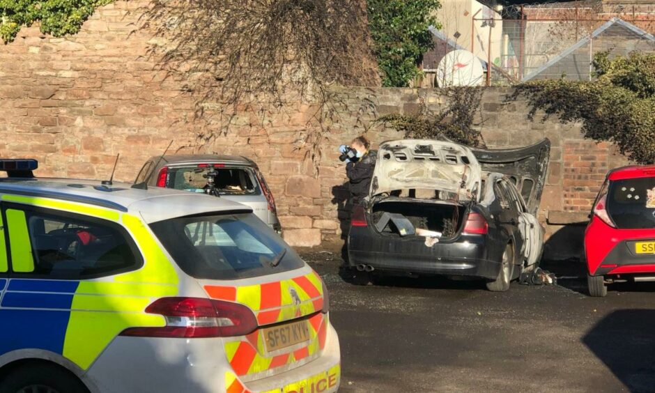 Burnt out BMW scene in Lochee