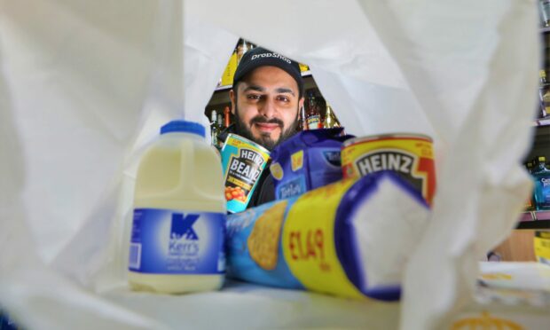 Businessman Faisal Naseem at his store in Dundee. Pic: Gareth Jennings/DCT Media.