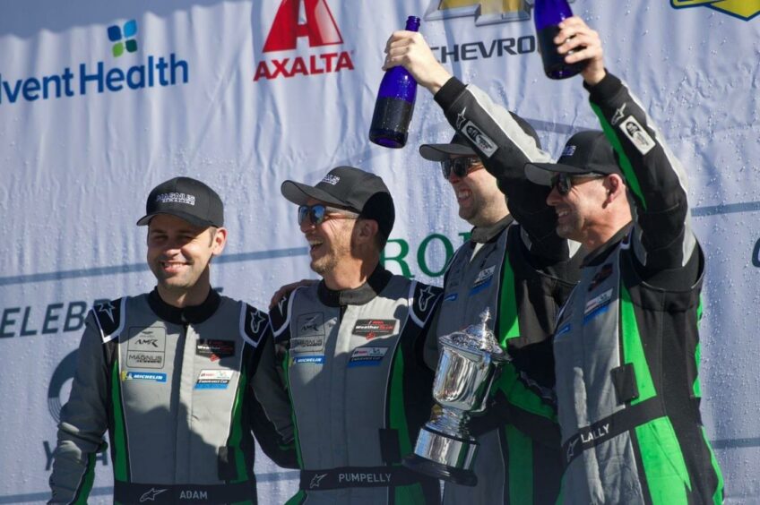 Jonny Adam (left) enjoys the Daytona 24 celebration. Pic: Aston Martin Racing.