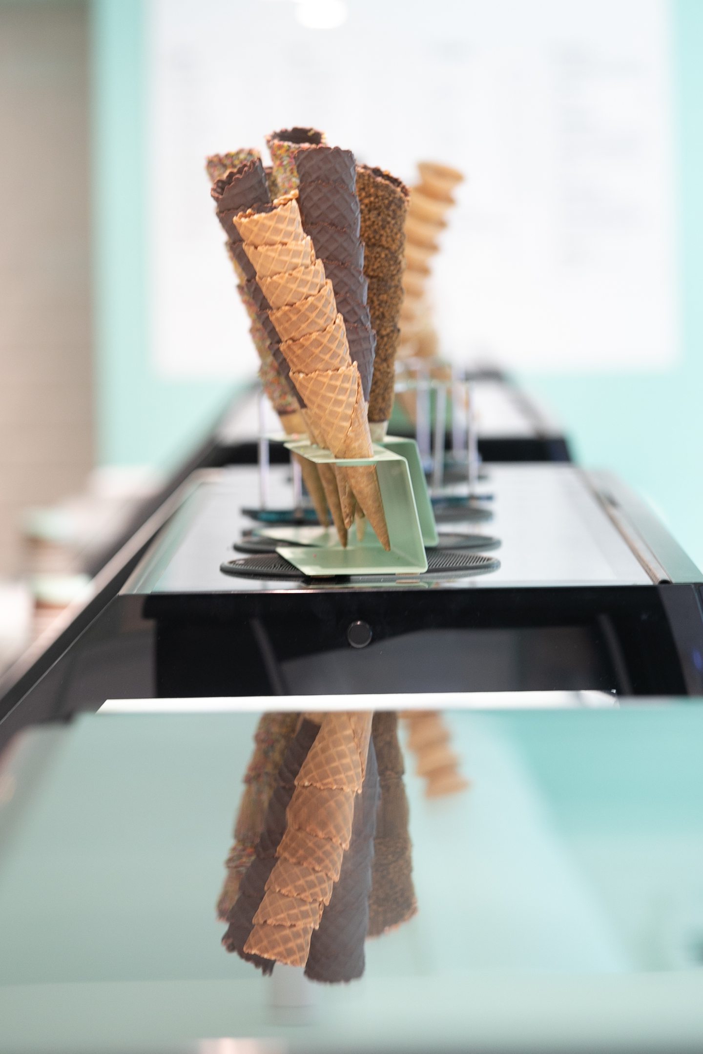 ice cream cones in a rack on a counter at Janettas Gelateria in Dundee