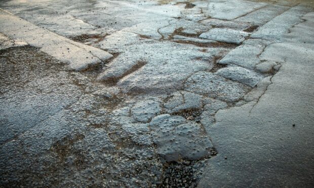 Potholes in Tayport, Fife. Image: Kim Cessford / DC Thomson.