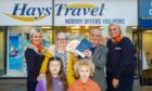 Winners of the Tele holiday competition with Hays Travel. Jemima and William Mackay with their grandchildren Willow, 7, and Louie, 5 receive their tickets and money from Chloe Dailly and Sandra Jamieson from Hays Travel Dundee.