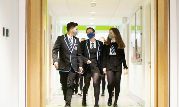 Pupils and staff in Tayside and Fife are being encouraged to continue wearing face masks in school as government requirements come to end.