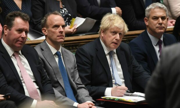 (Left-right) Commons Leader Mark Spencer, Justice Minister and Deputy Prime Minister Dominic Raab and Prime Minister Boris Johnson (second right) during Prime Minister's Questions in the House of Commons. Picture by UK Parliament/Jessica Taylor/PA Wire.