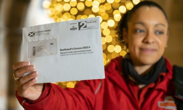 Postal worker Patrona Tunilla with a census letter.