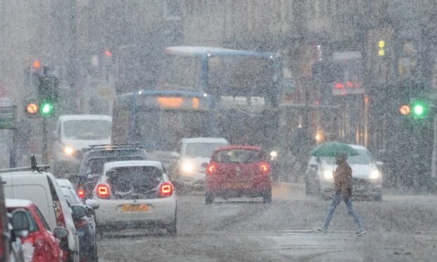 Parts of Tayside and Fife have been hit by snow. Picture shows Scott Street in Perth on Friday morning.