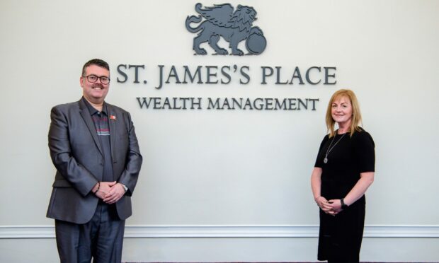 Scott James, of Scott James & Associates, with mortgage advisor Jackie Cowe.