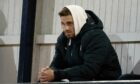 David Goodwillie watched Raith Rovers' clash with Queen of the South before the club u-turned on the signing.
